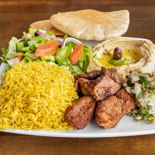 Beef Kabab Plate - Juicy beef kababs grilled to perfection, served with rice and fresh salad.