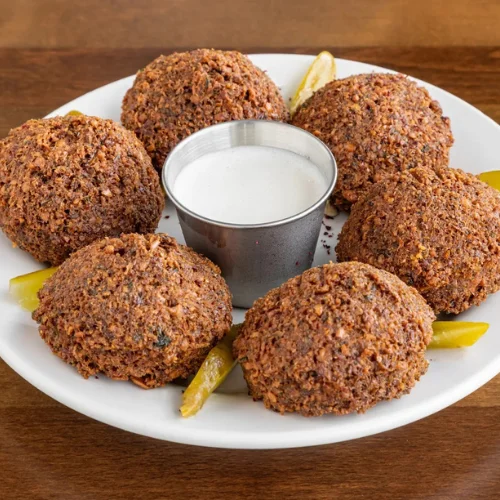 Falafel (6 Pieces) - Crispy golden falafel made from fresh chickpeas and herbs.